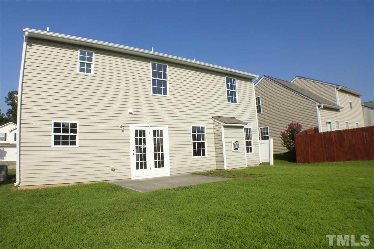 3813 Tyler Bluff Lane Raleigh, NC 27616 - Photo 23 of 25 a front view of a house with a yard