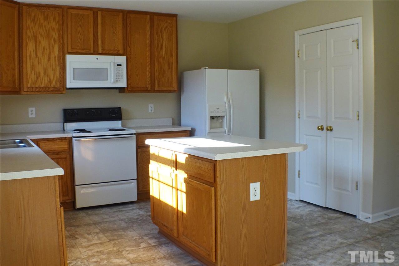 3813 Tyler Bluff Lane Raleigh, NC 27616 - Photo 5 of 25 a utility room with washer and dryer