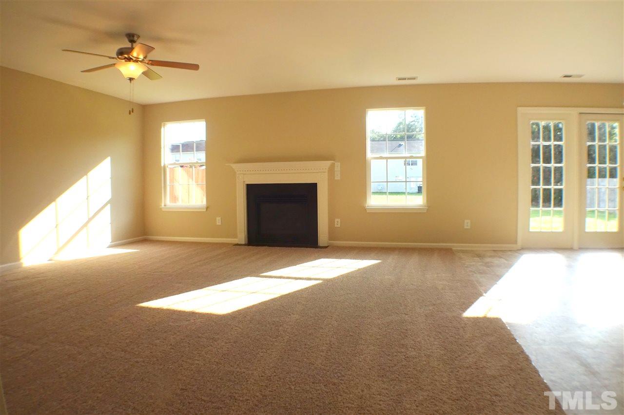3813 Tyler Bluff Lane Raleigh, NC 27616 - Photo 9 of 25 a view of an empty room with a window