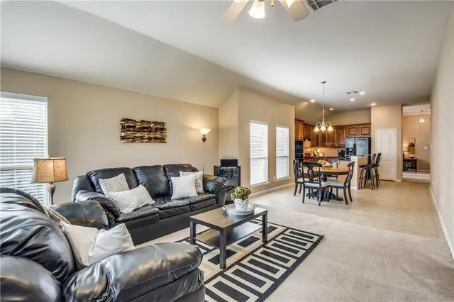 a living room with furniture and a table