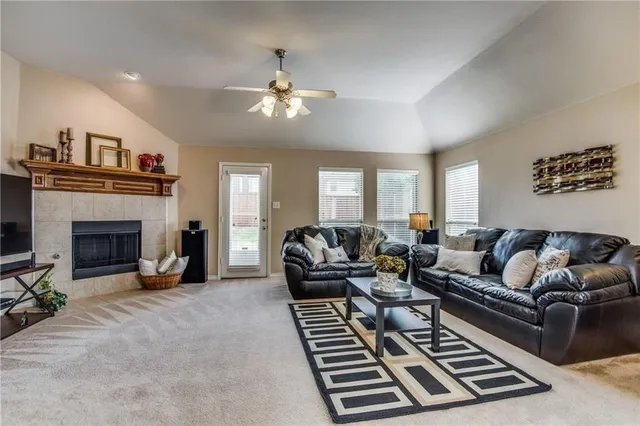 a living room with furniture and a fireplace