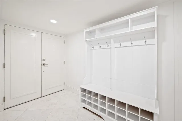 a view of a building with pool and sitting area