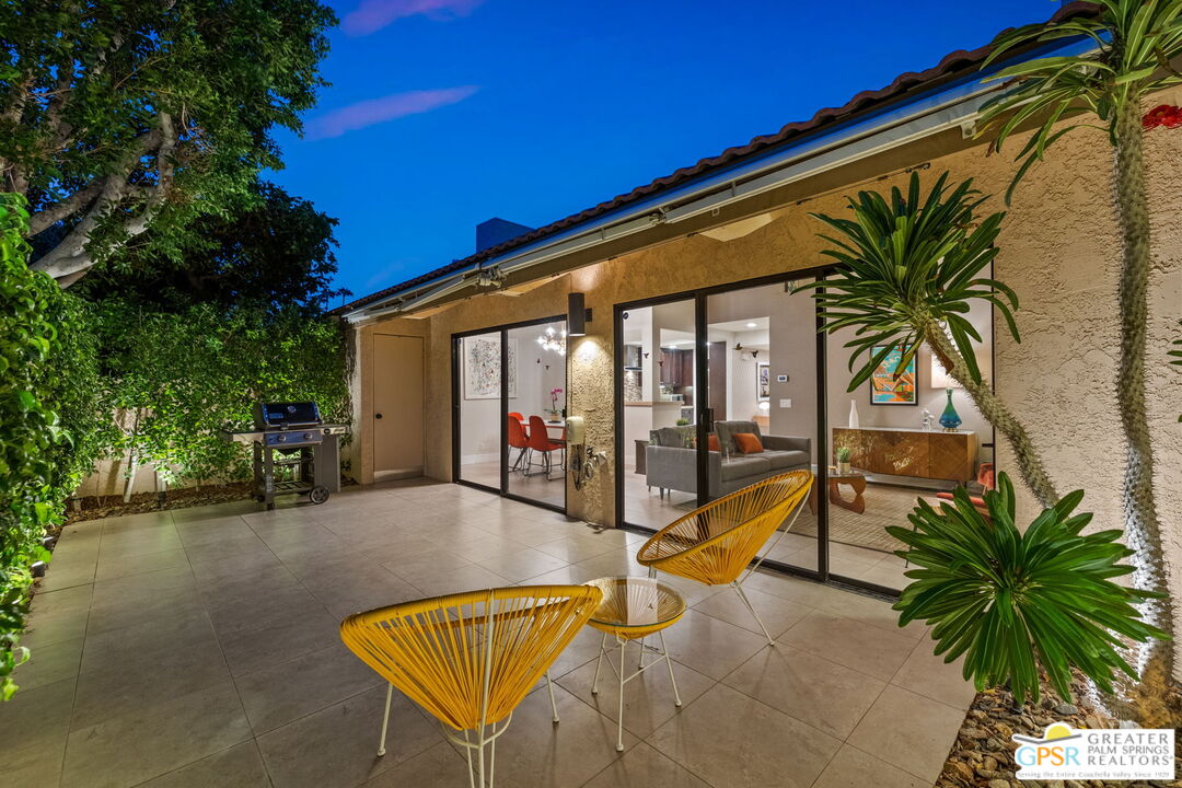 70100 Mirage Cove Drive, Unit 10 Rancho Mirage, CA 92270 - Photo 20 of 68 a view of a backyard with a patio and swimming pool