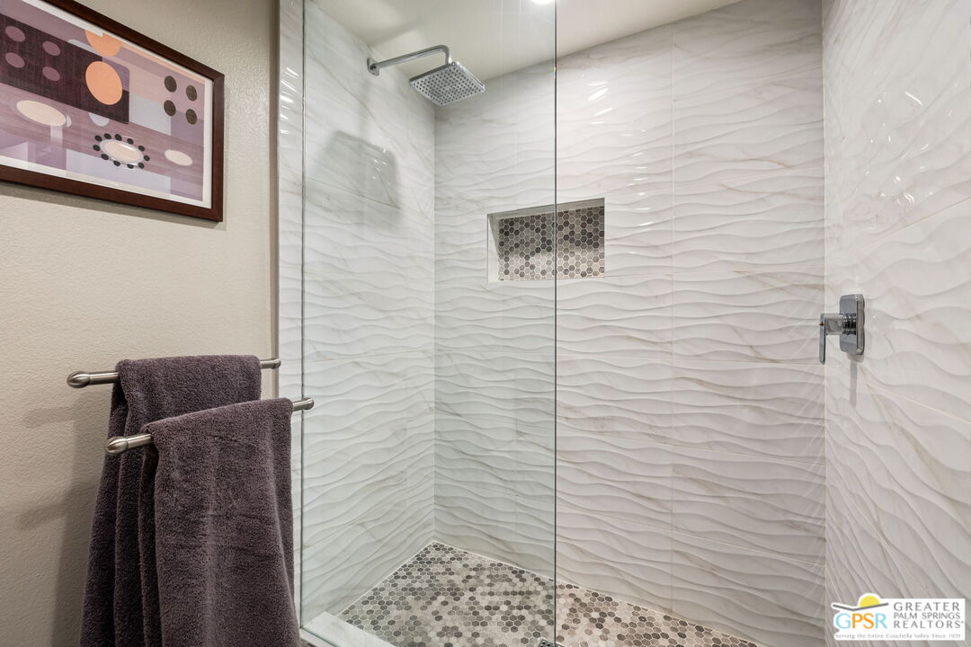 70100 Mirage Cove Drive, Unit 10 Rancho Mirage, CA 92270 - Photo 34 of 68 a bathroom with a shower and a shower