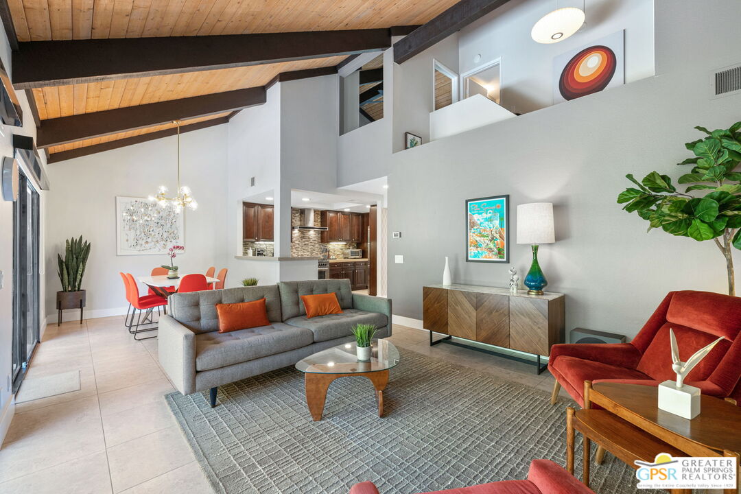 70100 Mirage Cove Drive, Unit 10 Rancho Mirage, CA 92270 - Photo 38 of 68 a living room with furniture and wooden floor