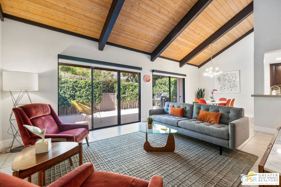 70100 Mirage Cove Drive, Unit 10 Rancho Mirage, CA 92270 - Photo 39 of 68 a living room with furniture and a large window