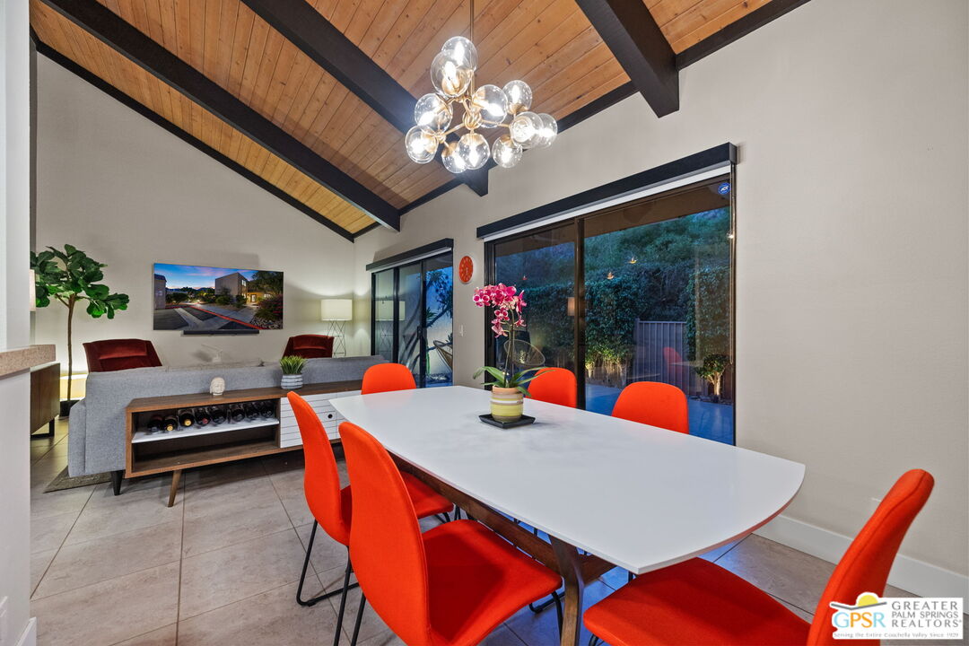 70100 Mirage Cove Drive, Unit 10 Rancho Mirage, CA 92270 - Photo 5 of 68 a view of a dining room with furniture and chandelier
