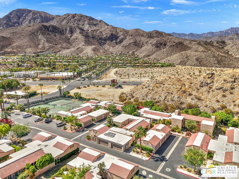 70100 Mirage Cove Drive, Unit 10 Rancho Mirage, CA 92270 - Photo 68 of 68 an aerial view of residential house and sandy dunes