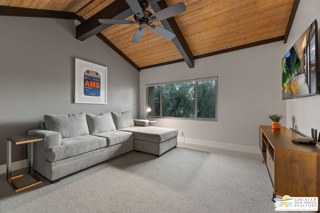 70100 Mirage Cove Drive, Unit 10 Rancho Mirage, CA 92270 - Photo 7 of 68 a living room with furniture and a window