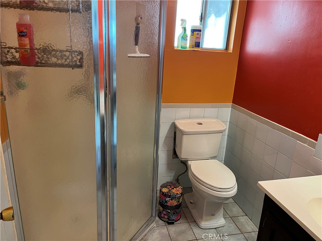 7763 Compton Avenue Los Angeles, CA 90001 - Photo 13 of 20 a white toilet sitting next to a small bathroom