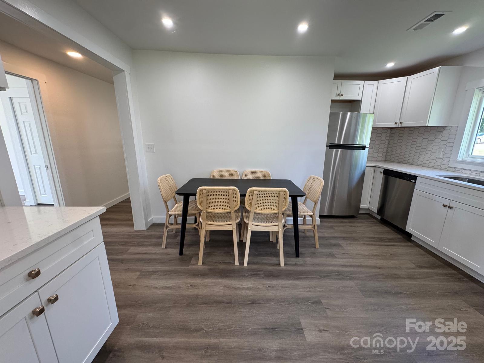 1018 Union Street Maiden, NC 28650 - Photo 11 of 46 a view of a dining room with furniture and wooden floor
