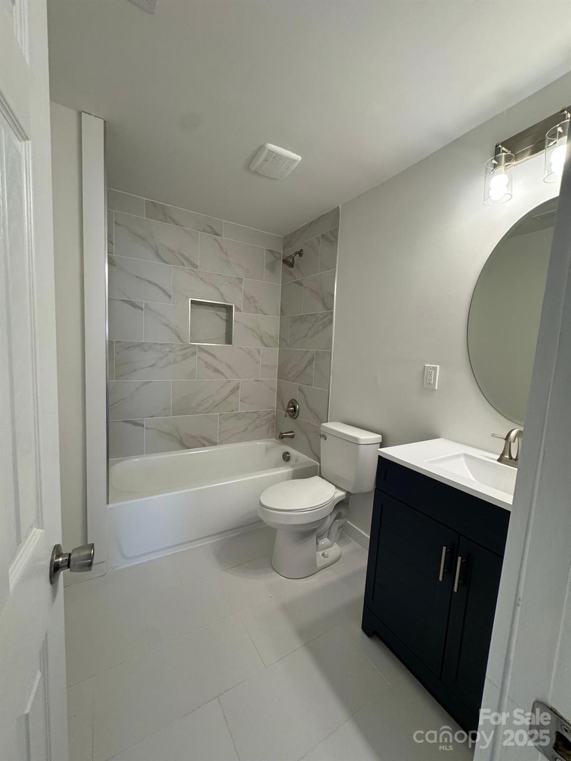 1018 Union Street Maiden, NC 28650 - Photo 20 of 46 a bathroom with a sink a toilet and shower