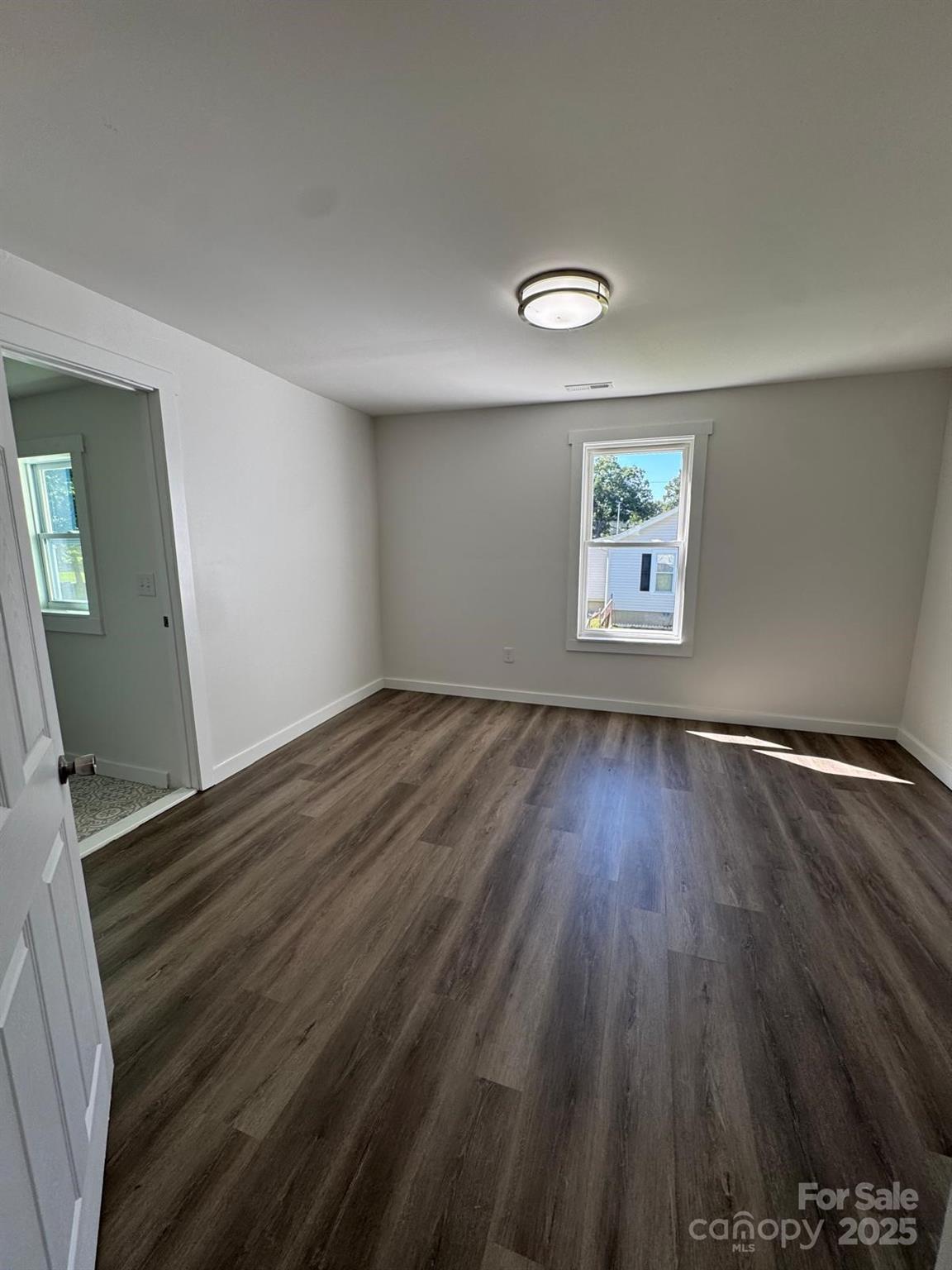 1018 Union Street Maiden, NC 28650 - Photo 22 of 46 wooden floor in an empty room with a window