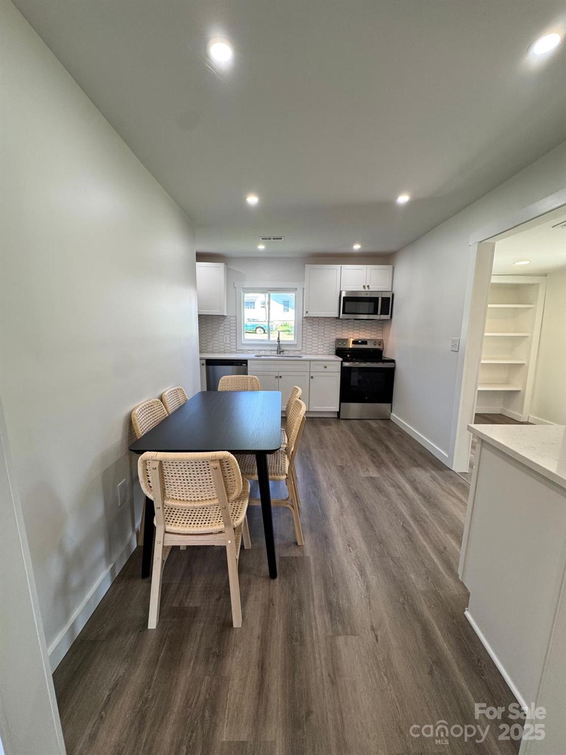 1018 Union Street Maiden, NC 28650 - Photo 10 of 46 a kitchen with a table and chairs in it