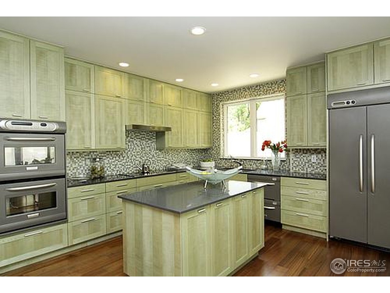 429 Spruce Street Boulder, CO 80302 - Photo 11 of 25 a kitchen with stainless steel appliances granite countertop a sink stove and refrigerator