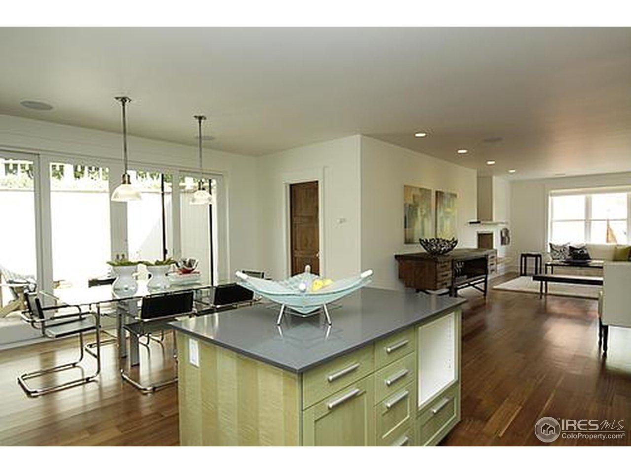 429 Spruce Street Boulder, CO 80302 - Photo 13 of 25 a living room with couches and kitchen view with wooden floor