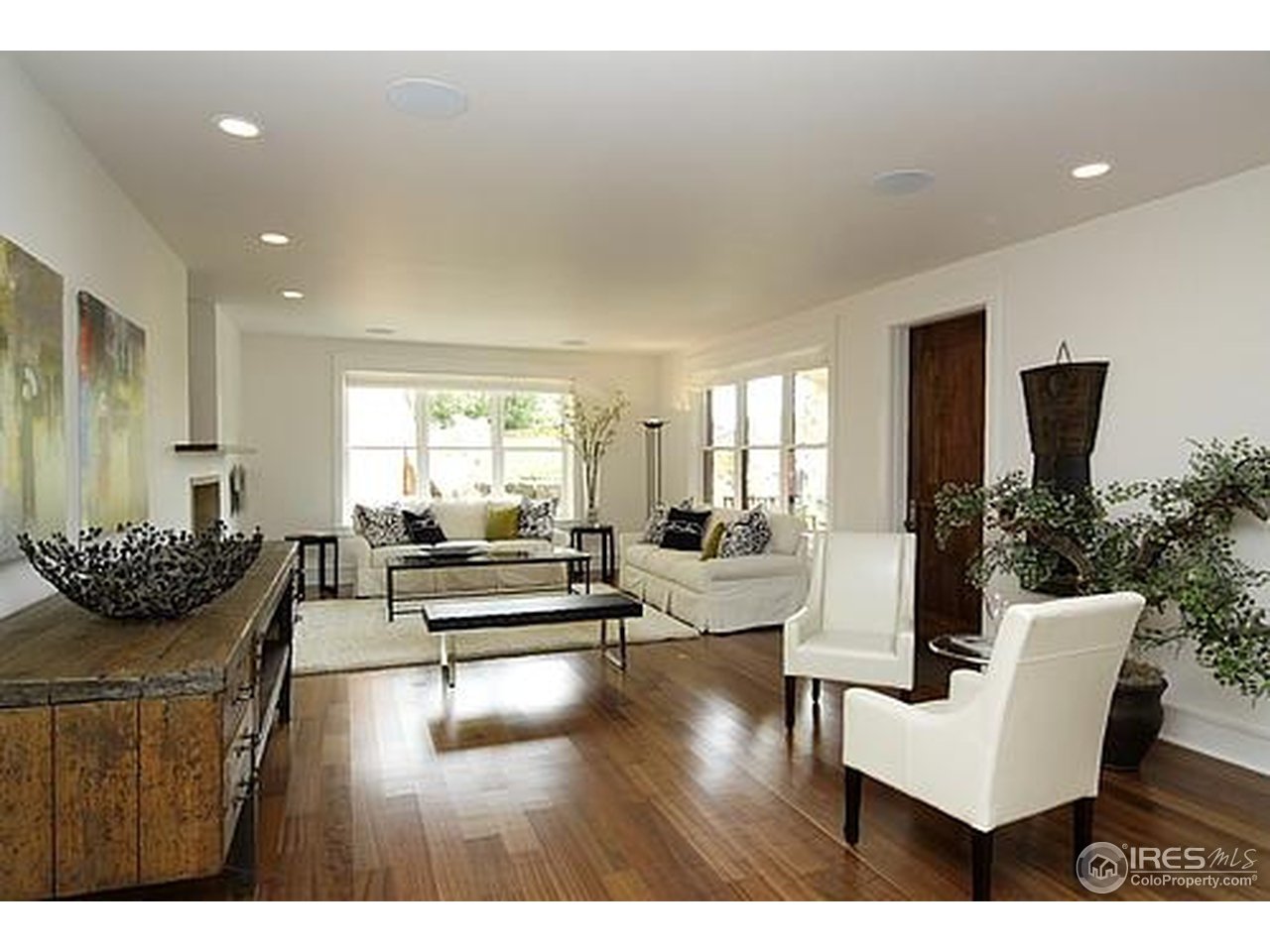 429 Spruce Street Boulder, CO 80302 - Photo 15 of 25 a living room with furniture wooden floor and a large window