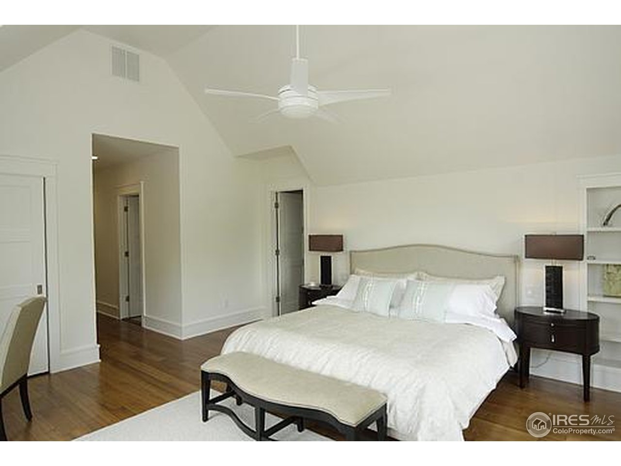 429 Spruce Street Boulder, CO 80302 - Photo 18 of 25 a bedroom with a bed and wooden floor