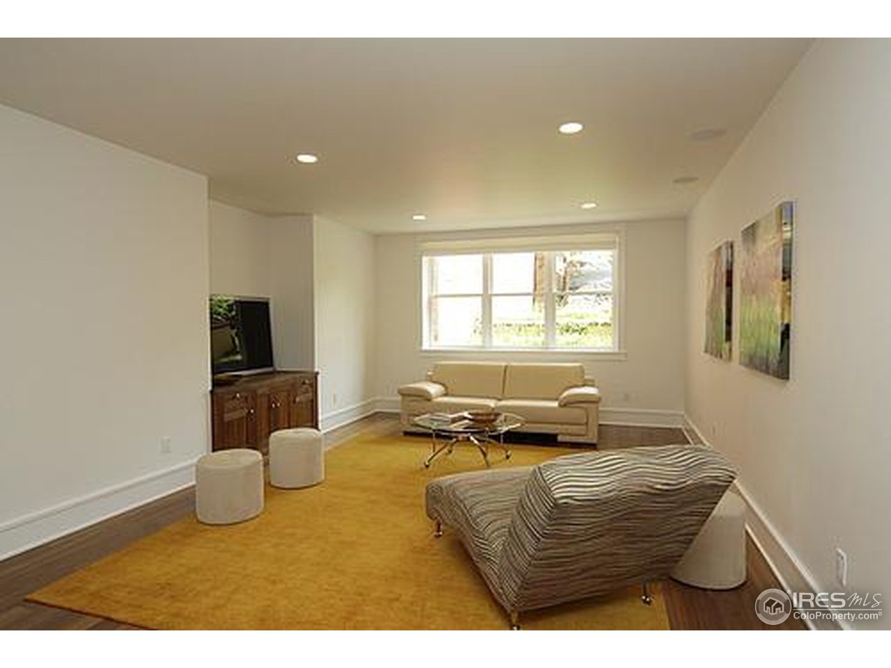429 Spruce Street Boulder, CO 80302 - Photo 22 of 25 a living room with furniture window and a flat screen tv