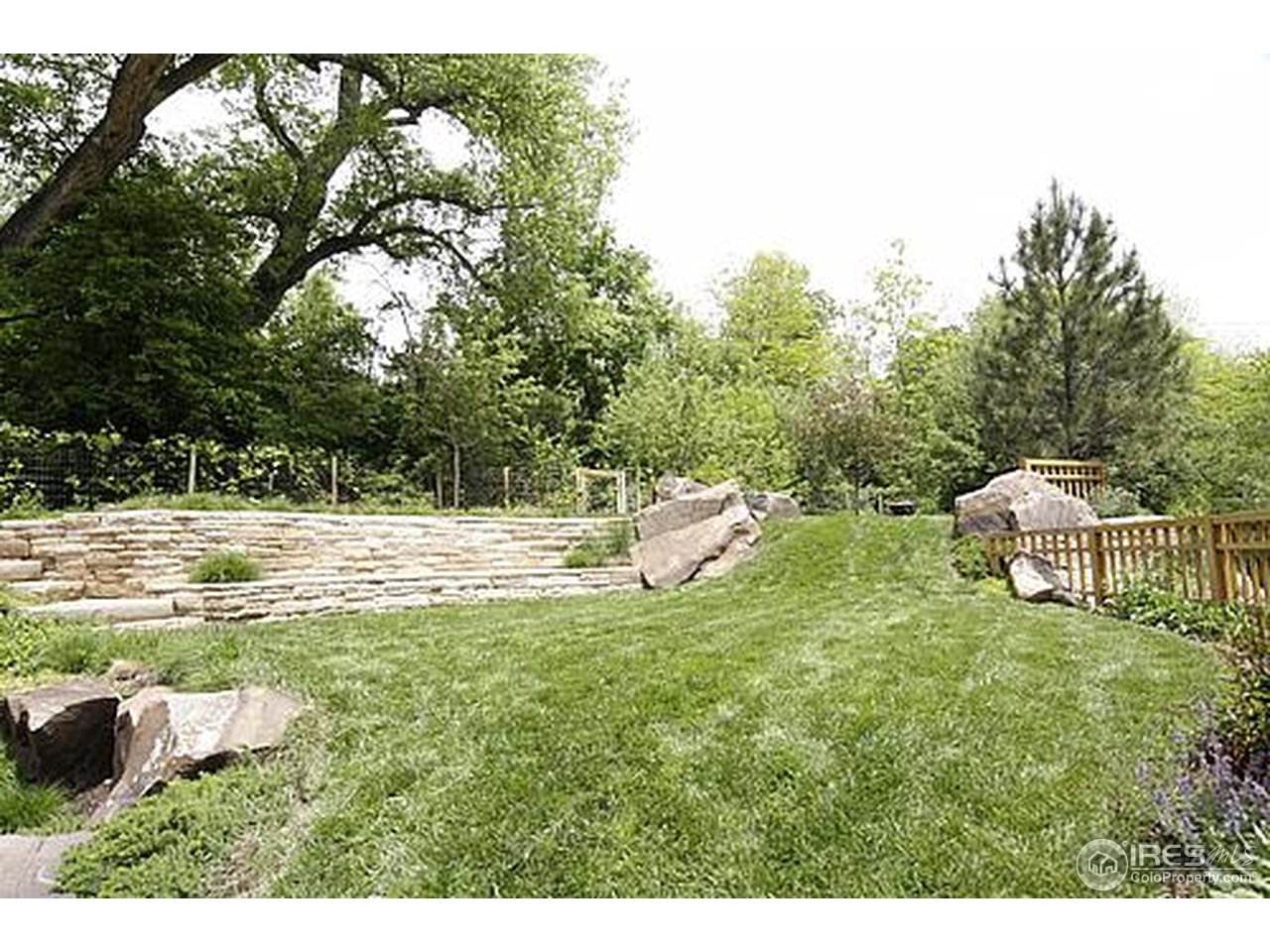 429 Spruce Street Boulder, CO 80302 - Photo 4 of 25 a swimming pool with wooden fence