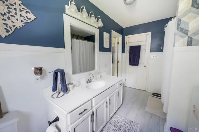 a view of a livingroom with lounge chair and a window