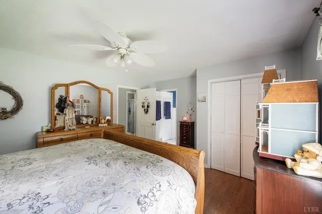 a view of a house with a yard chairs and floor to ceiling window