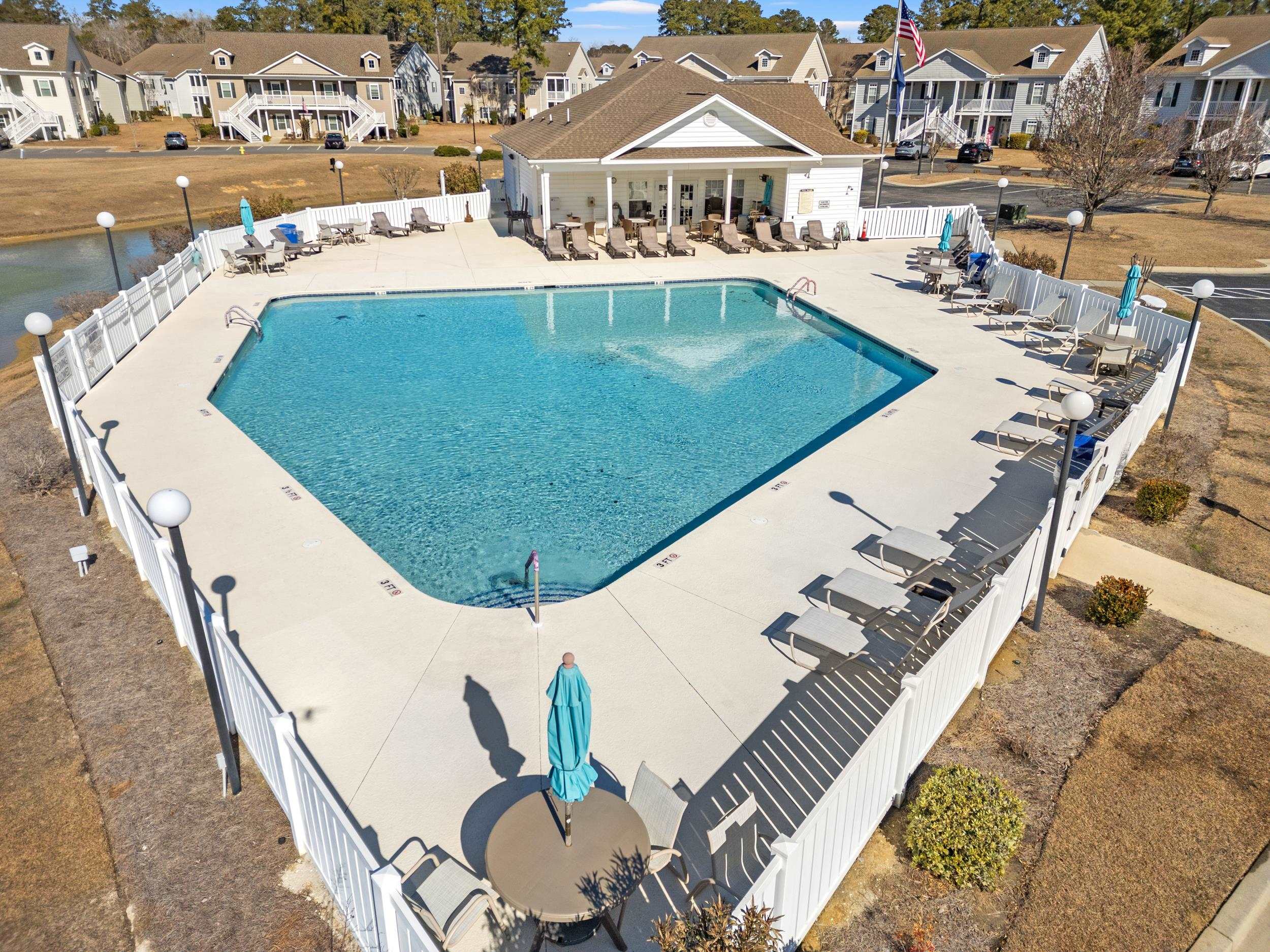 900 Jackline Place, Unit 202 Murrells Inlet, SC 29576 - Photo 37 of 39 Community pool featuring a patio area and a residential view