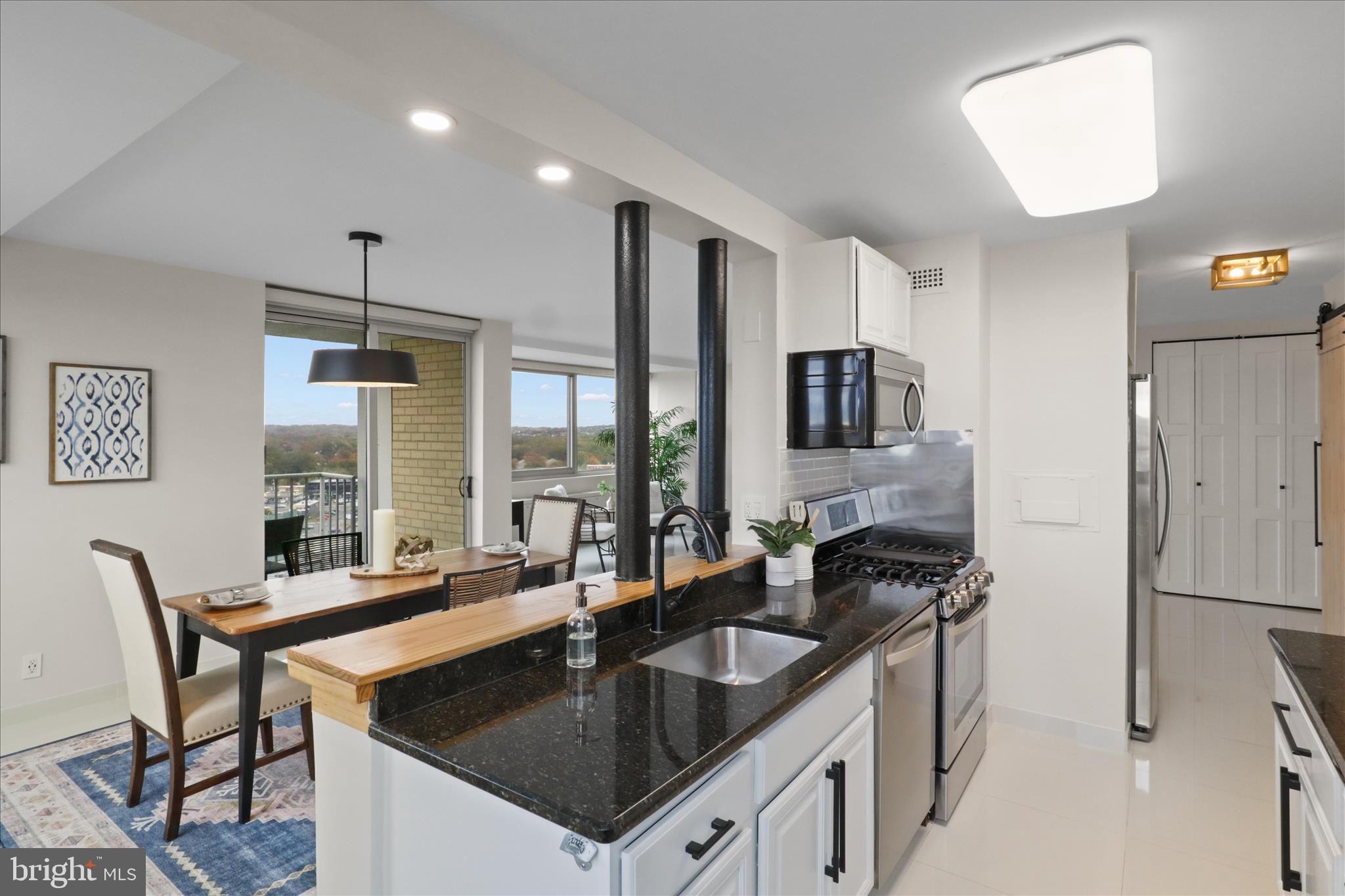 301 North Beauregard Street, Unit 1605 Alexandria, VA 22312 - Photo 12 of 42 a kitchen with granite countertop a sink appliances and cabinets