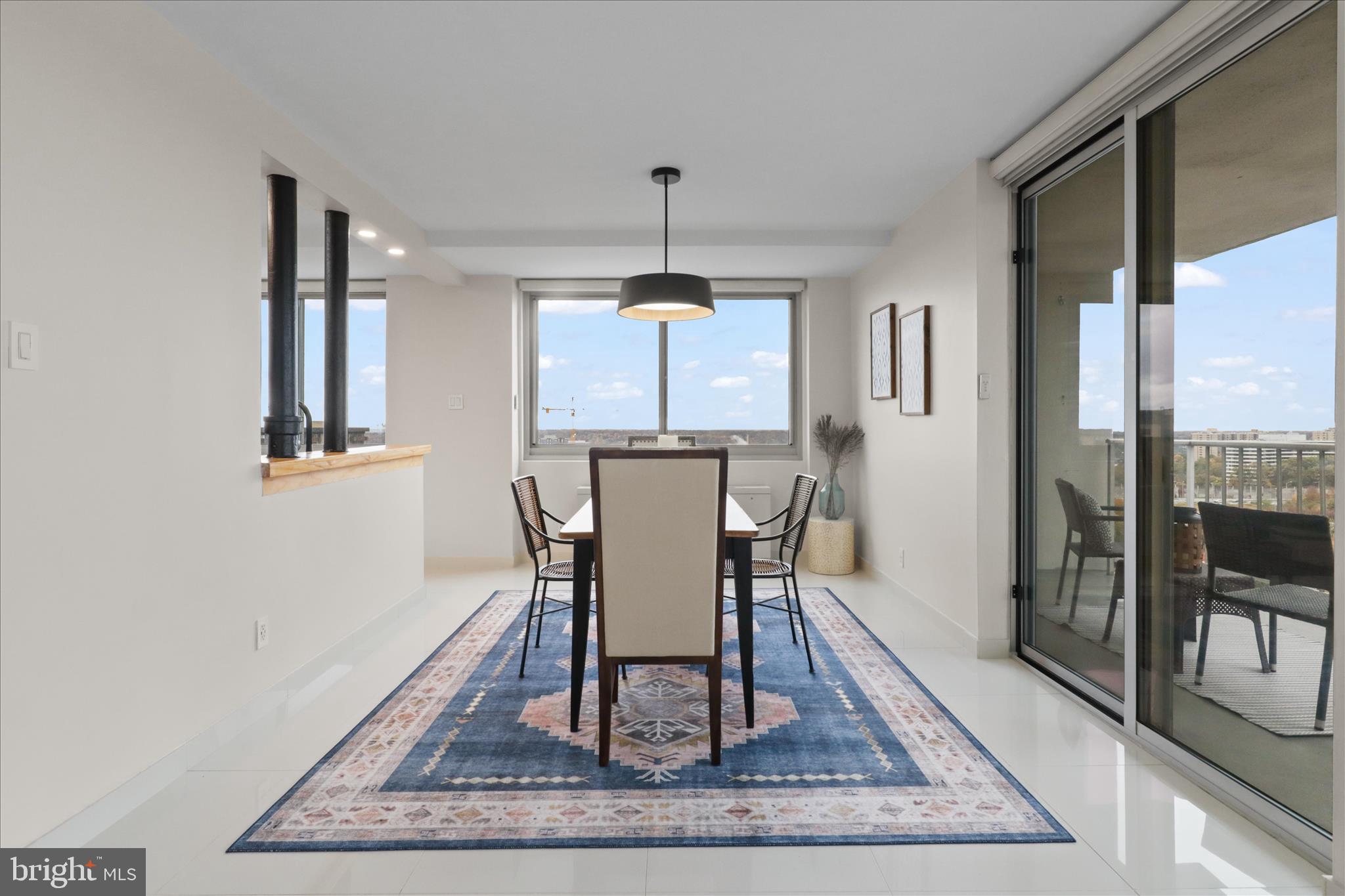 301 North Beauregard Street, Unit 1605 Alexandria, VA 22312 - Photo 9 of 42 a dining room with wooden floor and a rug