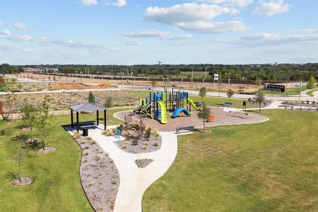 a swimming pool with outdoor seating and yard