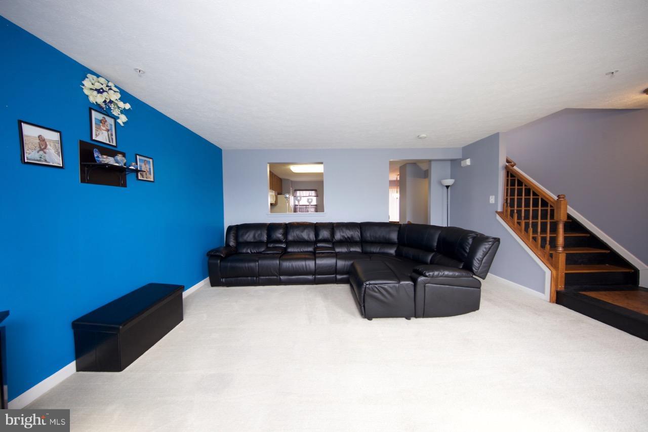 9701 Selfridge Road Baltimore, MD 21220 - Photo 12 of 29 a living room with furniture and a stairs
