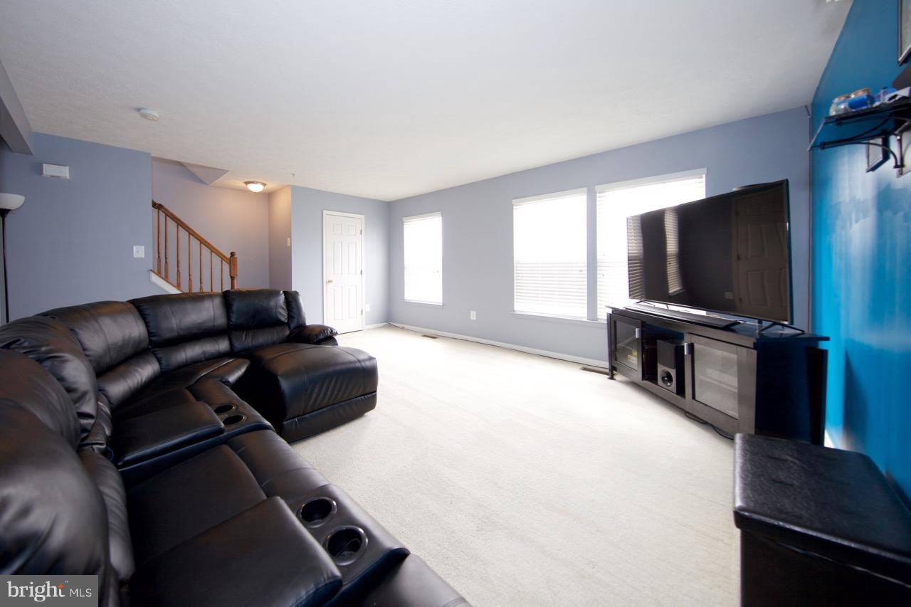 9701 Selfridge Road Baltimore, MD 21220 - Photo 13 of 29 a living room with furniture and a flat screen tv