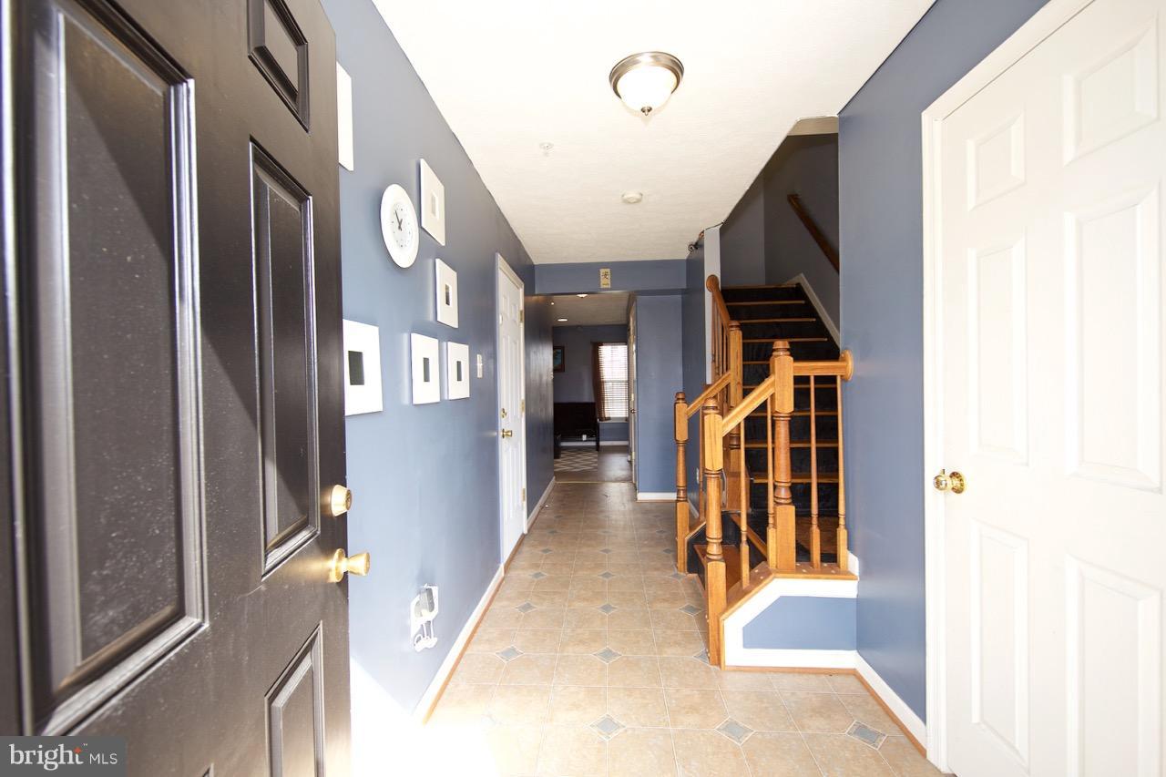 9701 Selfridge Road Baltimore, MD 21220 - Photo 3 of 29 a view of a hallway with a living area