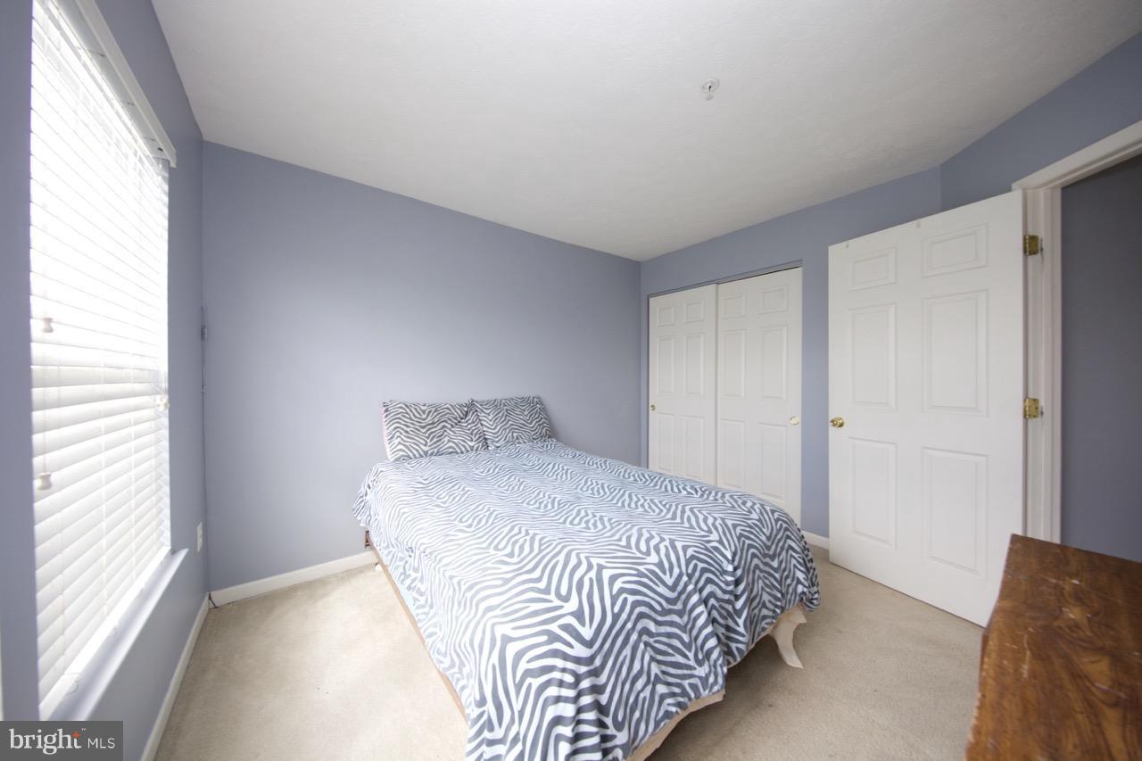 9701 Selfridge Road Baltimore, MD 21220 - Photo 21 of 29 a bedroom with a bed and a window