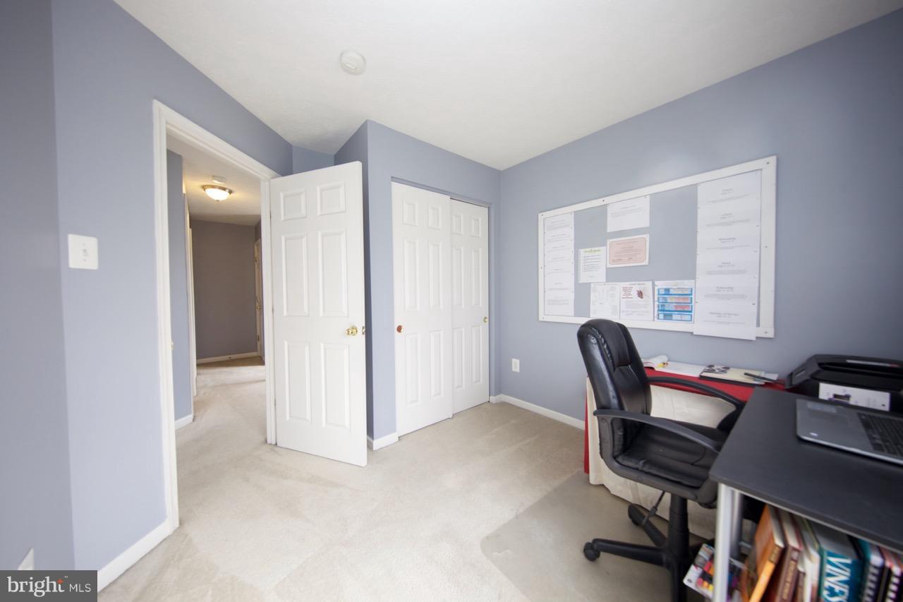 9701 Selfridge Road Baltimore, MD 21220 - Photo 23 of 29 a view of a workspace with furniture and a window