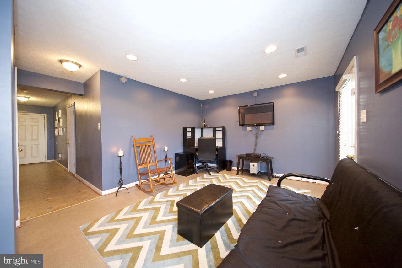 9701 Selfridge Road Baltimore, MD 21220 - Photo 25 of 29 a living room with furniture and a flat screen tv
