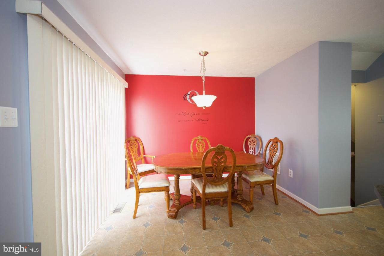 9701 Selfridge Road Baltimore, MD 21220 - Photo 9 of 29 a view of a dining room with furniture and chandelier