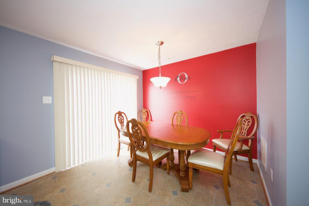 9701 Selfridge Road Baltimore, MD 21220 - Photo 10 of 29 a dining room with furniture and window
