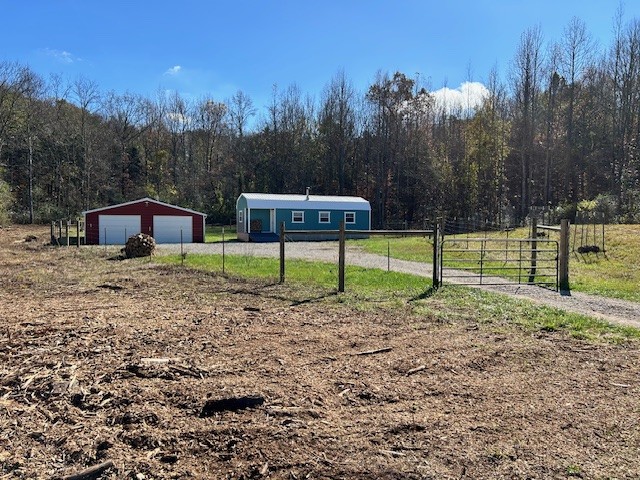 900 Ridge Road Quebeck, TN 38579 - Photo 25 of 46 a backyard of a house with lots of green space