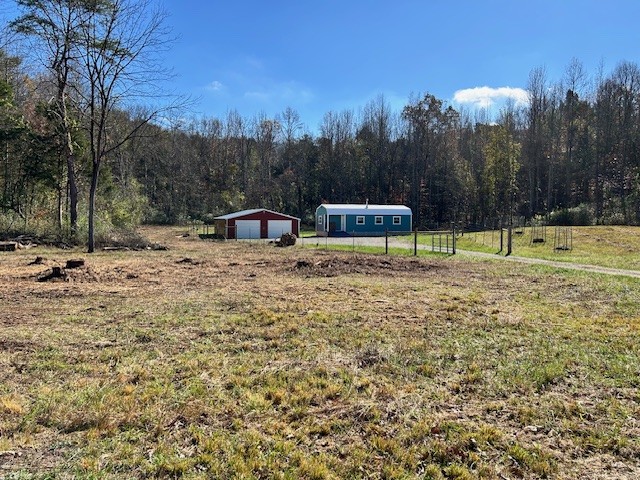 900 Ridge Road Quebeck, TN 38579 - Photo 26 of 46 a view of a house with a yard and trees