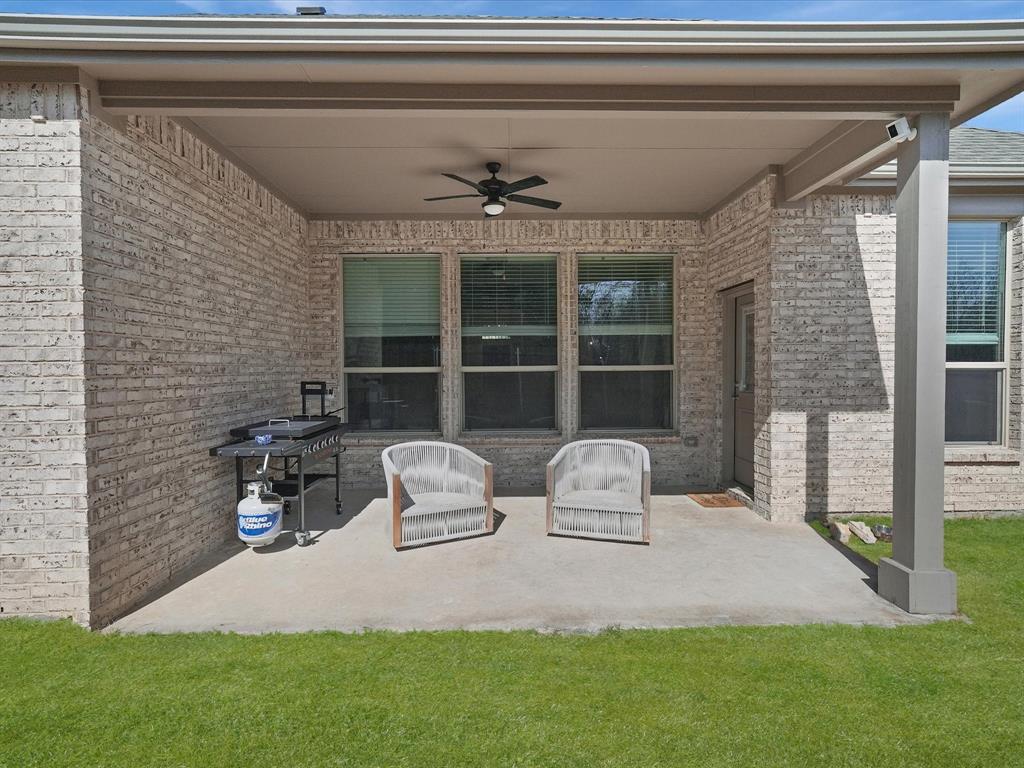 3711 Walnut Rdg Drive Grand Prairie, TX 76065 - Photo 21 of 24 a table and chairs in front of a door