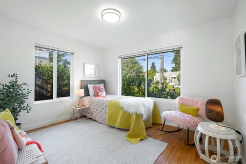 a bedroom with a bed and a couch