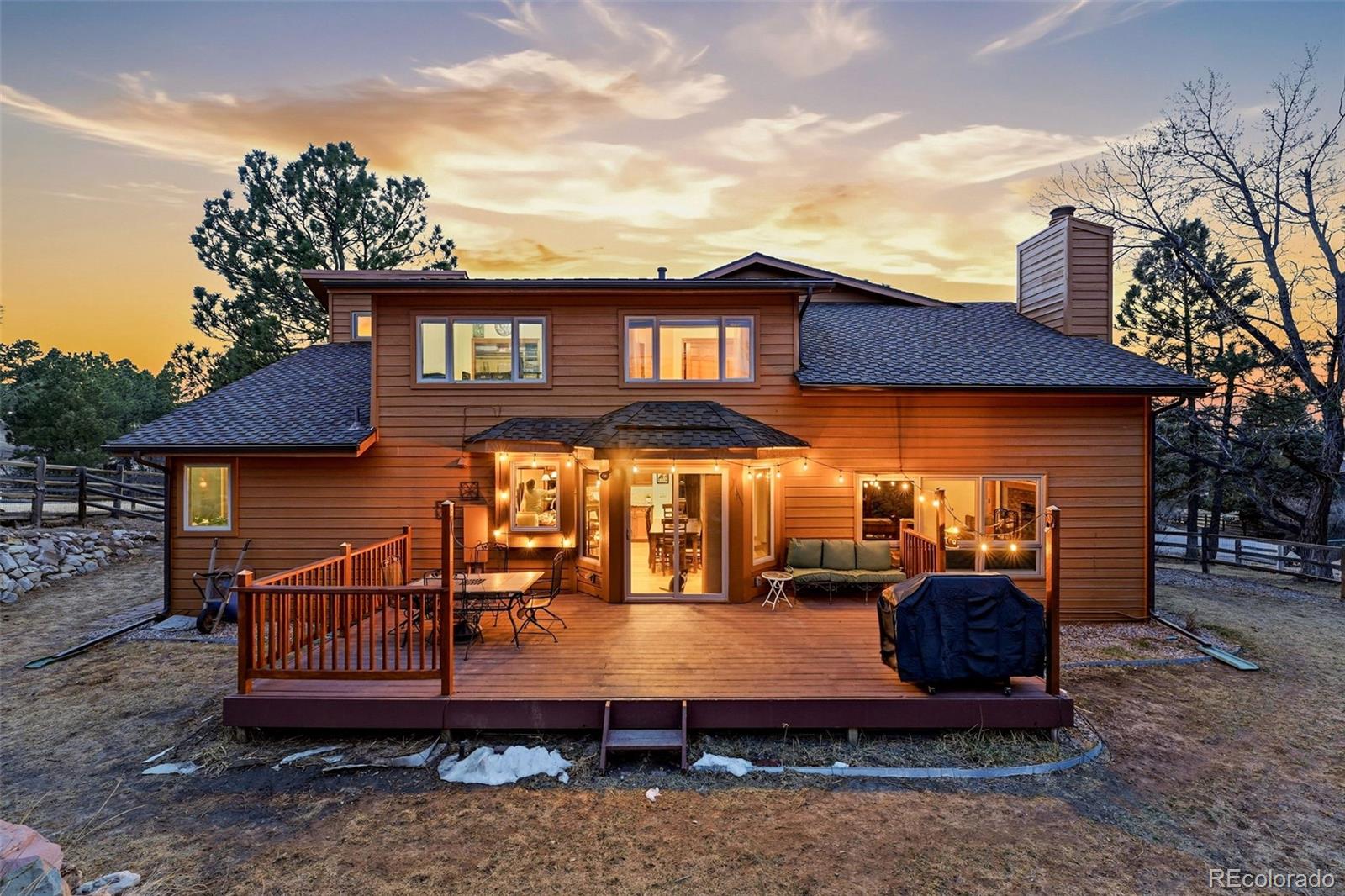 8915 Mad River Road Parker, CO 80134 - Photo 34 of 45 a view of a house with a yard