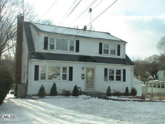 28 Fowler Street Stamford, CT 06905 - Photo 1 of 1 a front view of a house with a yard