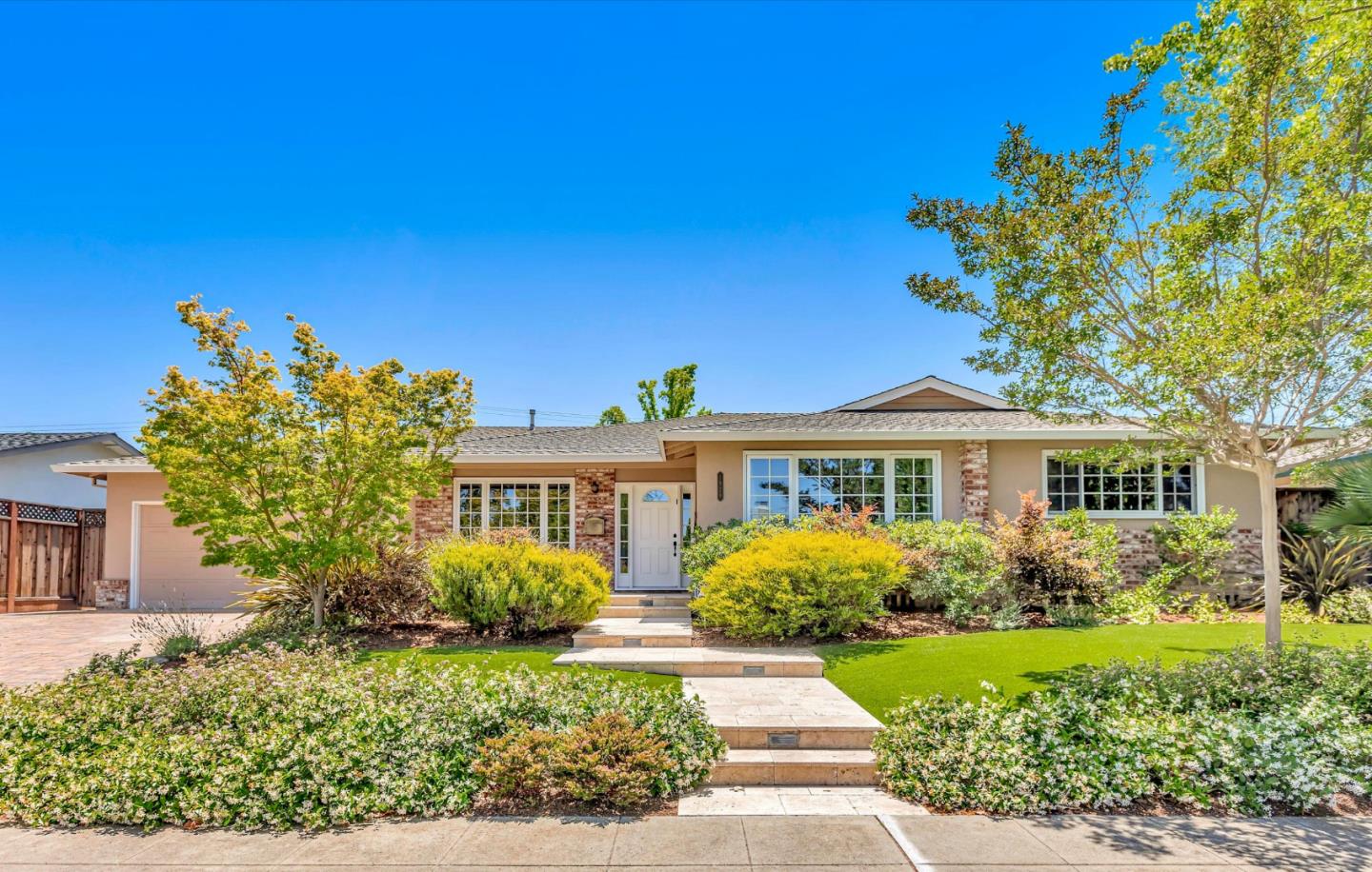 1929 Fordham Way Mountain View, CA 94040 - Photo 1 of 45 a front view of a house with a yard
