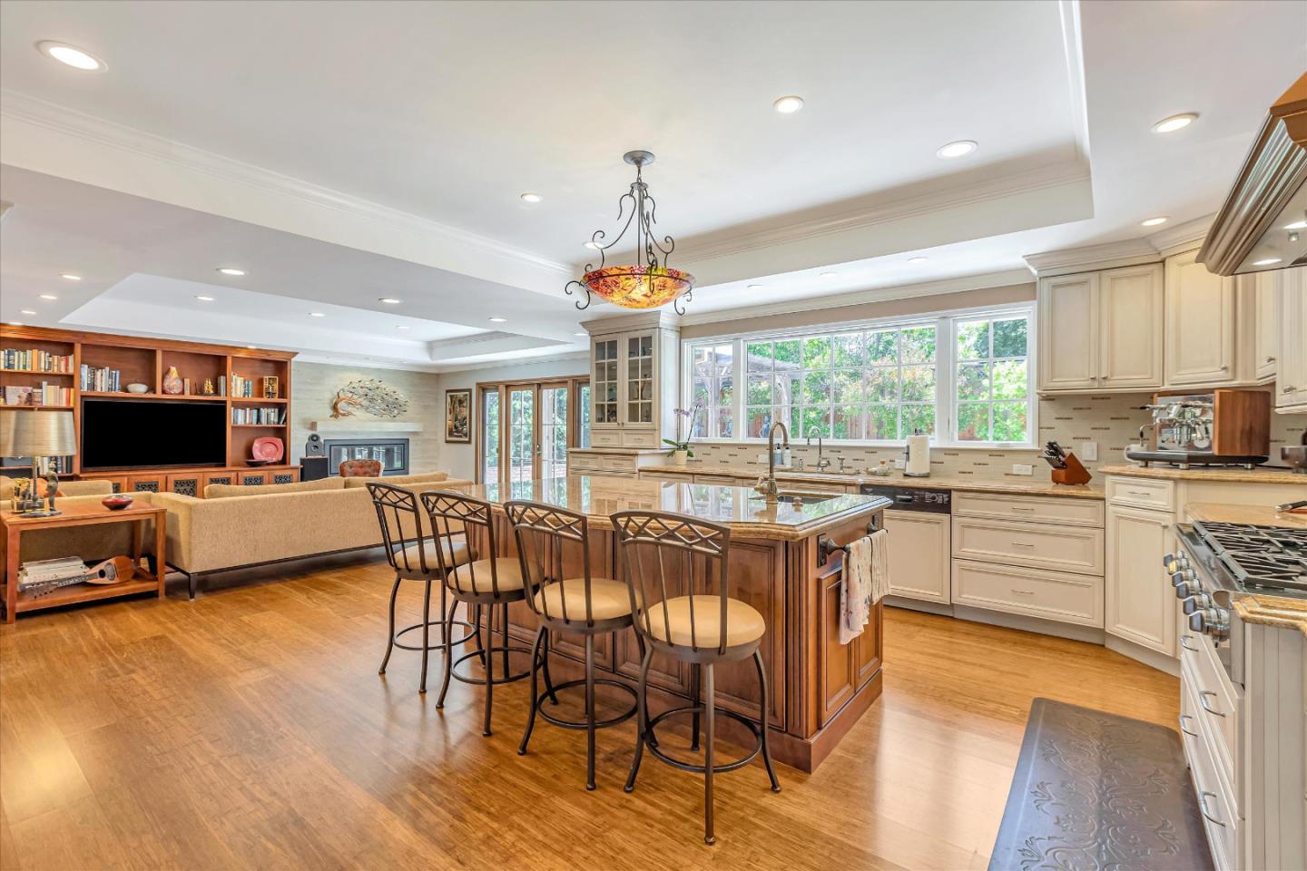 1929 Fordham Way Mountain View, CA 94040 - Photo 15 of 45 a kitchen with stainless steel appliances granite countertop wooden floor dining table and chairs