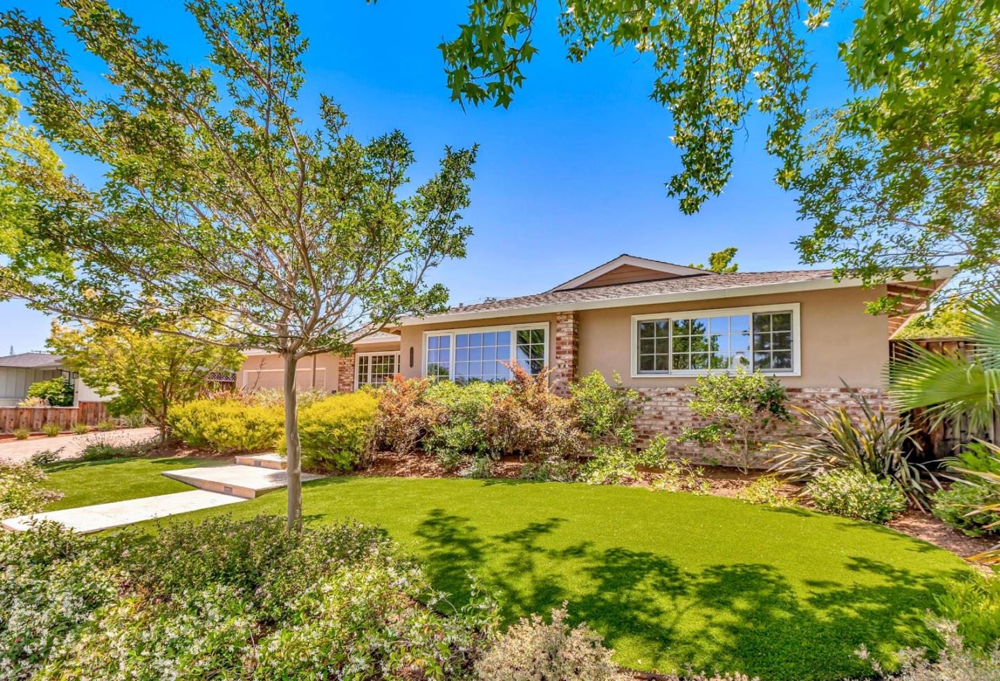 1929 Fordham Way Mountain View, CA 94040 - Photo 2 of 45 a front view of house with yard and green space