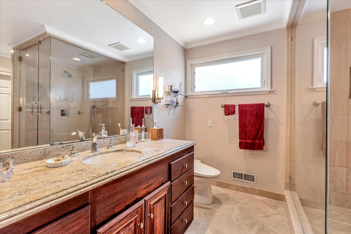 1929 Fordham Way Mountain View, CA 94040 - Photo 26 of 45 a bathroom with a granite countertop sink a toilet a mirror and shower