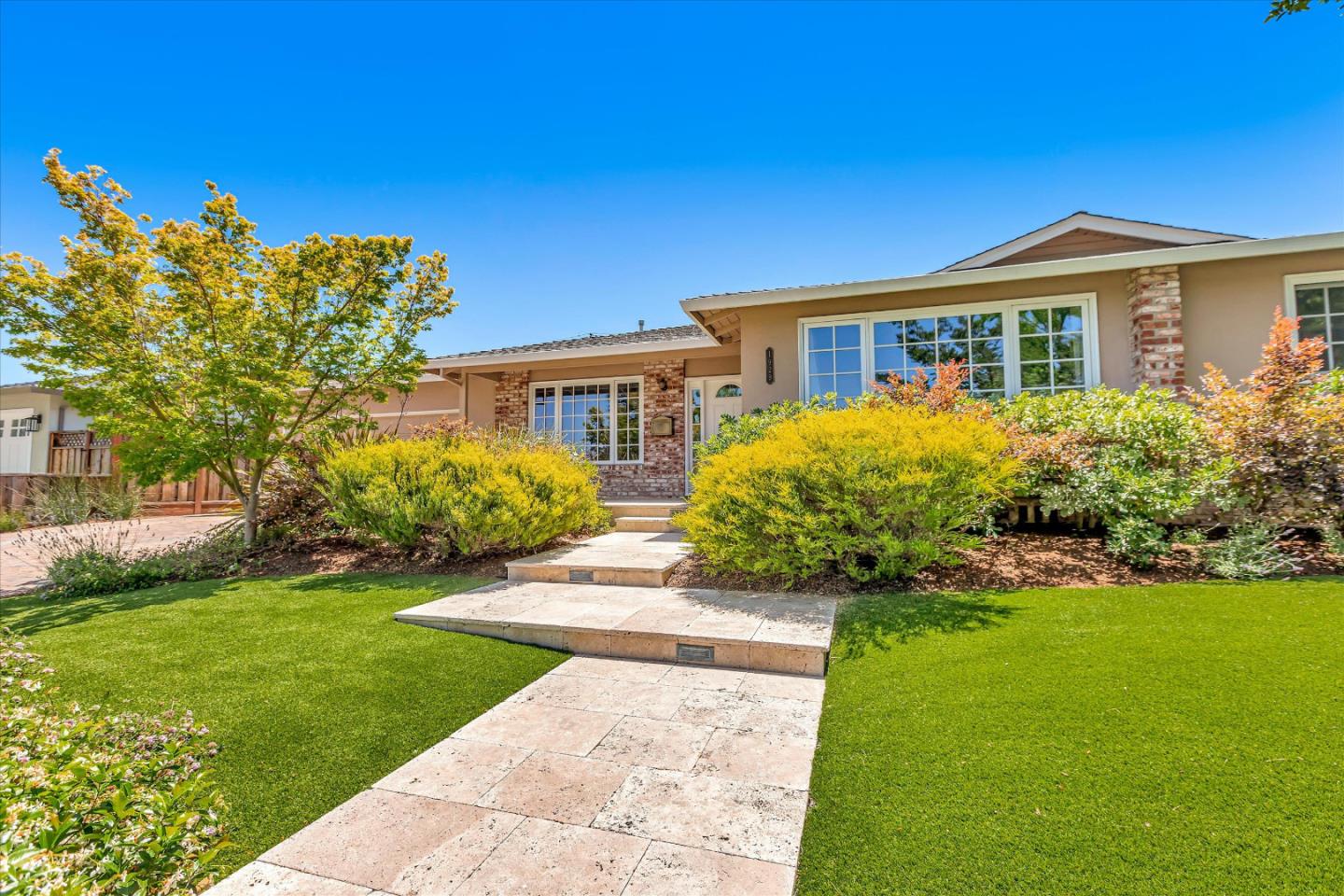 1929 Fordham Way Mountain View, CA 94040 - Photo 3 of 45 a front view of a house with a garden