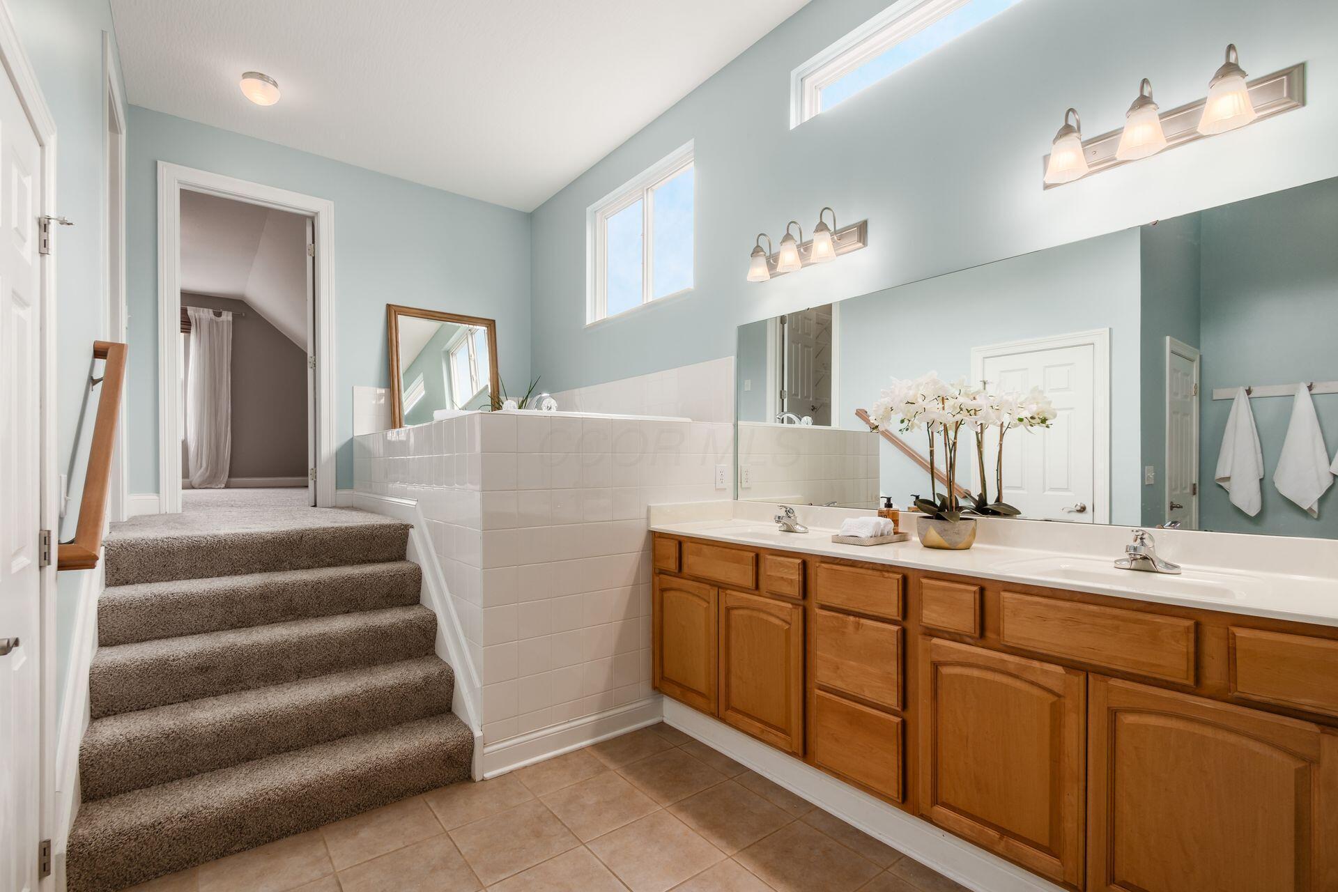 2467 Roe Drive Lewis Center, OH 43035 - Photo 24 of 50 The primary bath is spacious with two closets, plus a linen closet.